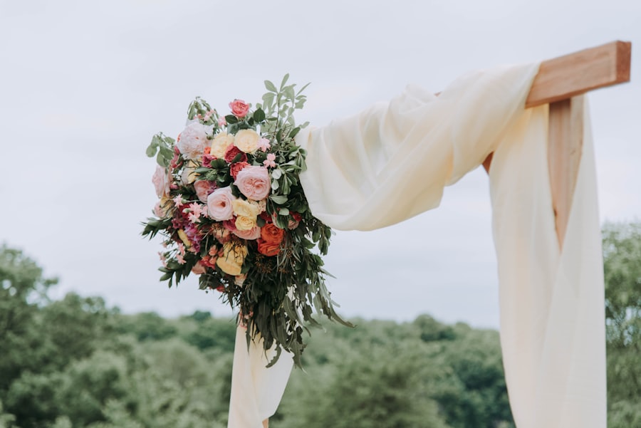 Gender reveal celebration with floral arch